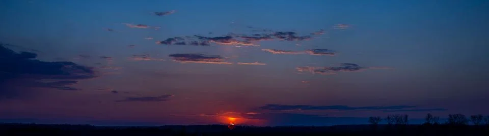 Sunset panorama with red clouds Stock Photos