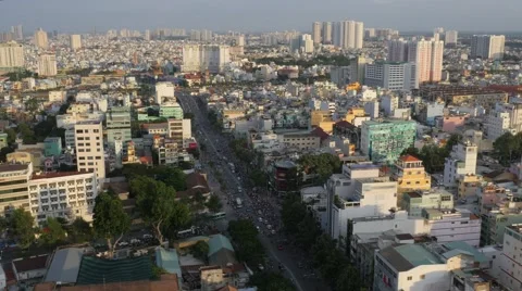 Sunset panorama of Saigon skyline, busy traffic below, Ho Chi Minh City, Vietnam Stock Footage 65890199