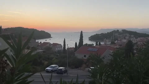 Sunset panoramic view over Cavtat with red-roofed houses, the bay and surroundin 動画素材 344391727