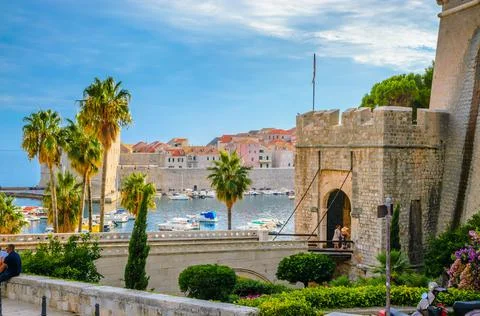 Sunset panoramic view on walls and port of famous old city Dubrovnik, Croatia Stock Photos