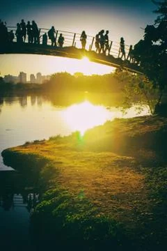 Sunset at the park over a bridge. 스톡 사진