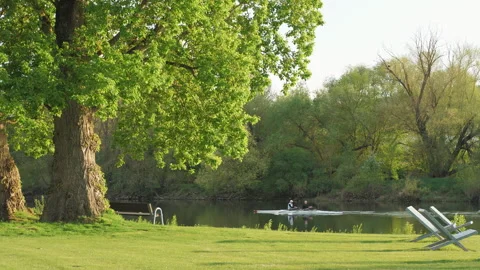 Sunset in the park with people canoeing. Nice nature. Stock Footage 272619388
