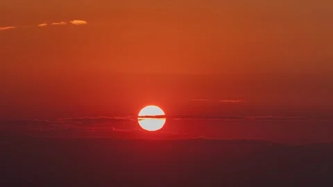 Sunset with Partial Solar Obscuration by Clouds Rayleigh Scattering 4K Video stock 332135351