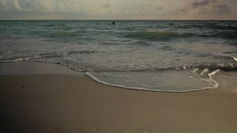 Sunset at Pass-a-grille Beach in St Petersburg Florida. Low light with multiple Stock Footage 276675883