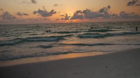 Sunset at Pass-a-grille Beach in St Petersburg Florida. Low light with multiple Stock Footage 276676381