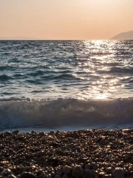 Sunset on pebble beach Stock-Fotos