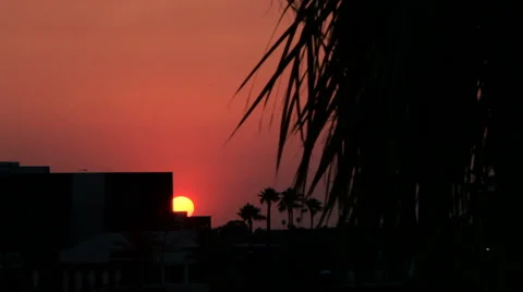 Sunset Peeking Out from Behind a Building. Stock Footage 61839839