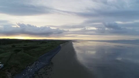 Sunset at Pendine Sands Cloudy Evening Beach Aerial Drone Shot Stock Footage 172576987