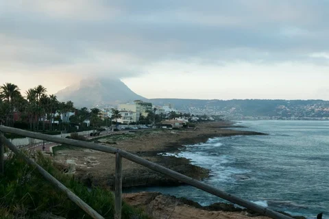 Sunset, People And Waves Over Coastline With Mountain Stock Footage 123132251
