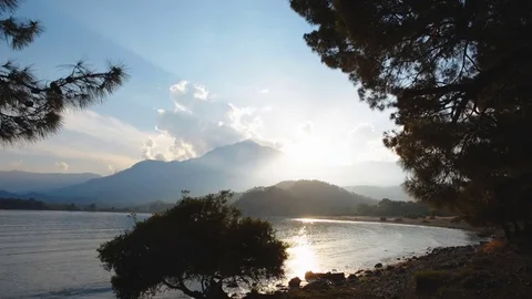 Sunset in a picturesque bay Stock Footage 79530629