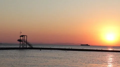 Sunset at Pier with Lifeguard Tower Stock Footage 328972641