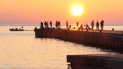 Sunset on the pier with people Stock Footage 106380372
