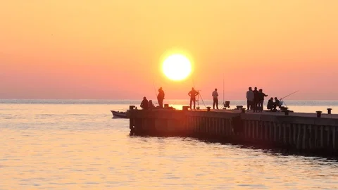 Sunset on the pier with people Stock Footage 106380724