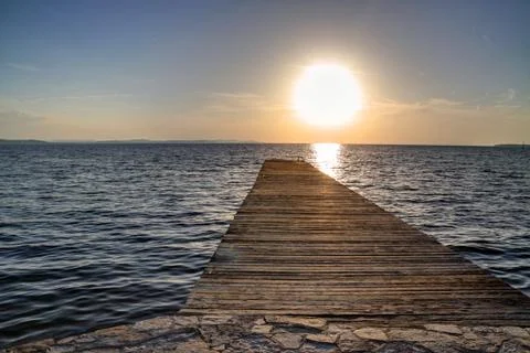 Sunset by the pier Stock Photos