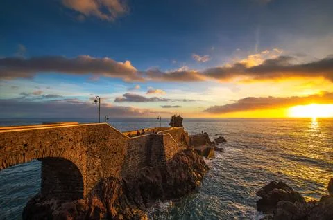 Sunset at the pier of Ponta do Sol in Madeira Island, Portugal Stock-Fotos