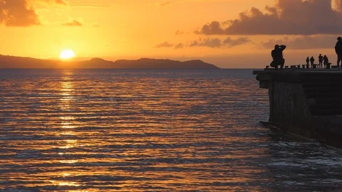 Sunset on the pier Torregaveta Stock Footage 121717812