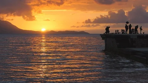 Sunset on the pier Torregaveta Stock Footage 121718618