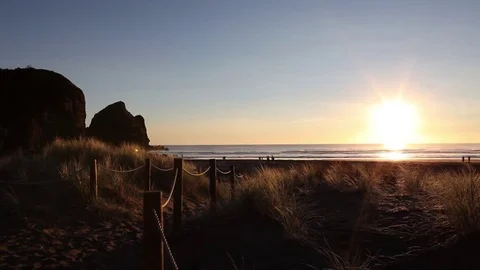 Sunset on Piha Beach Stock Footage 76688425