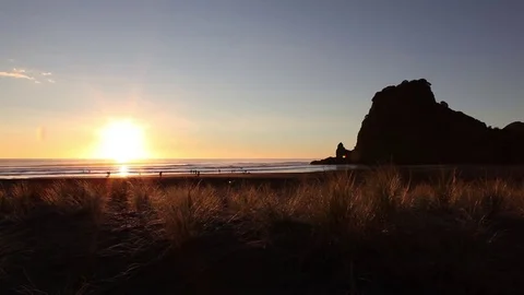 Sunset on Piha Beach Stock Footage 76688641