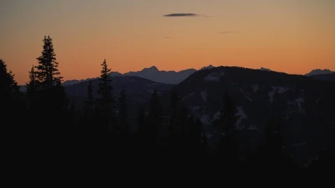 Sunset with pine trees and mountains Stock Footage 100520904