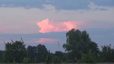 Sunset pink cloud over the meadow,  kayak, fire Stock-Footage 90784718
