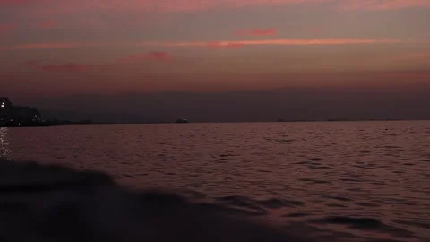 Sunset with Pink Clouds on the Coast (Slow Motion) Stock Footage 245456064