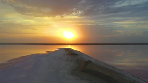 Sunset on the pink lake. Reflection in water. Stock Footage 136219148