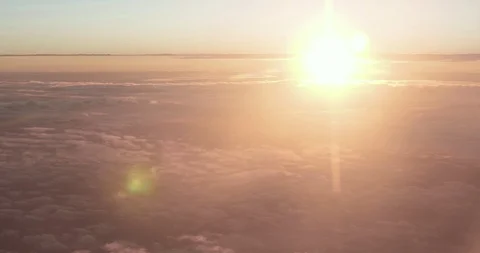 Sunset from a plane window at 10000 meters with mulitple levels of clouds Stock-Footage 107452175