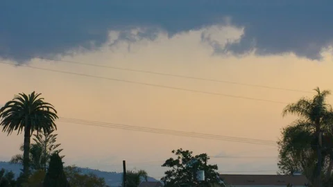 Sunset with planes passing, framed with palm trees. Stock Footage 89951148