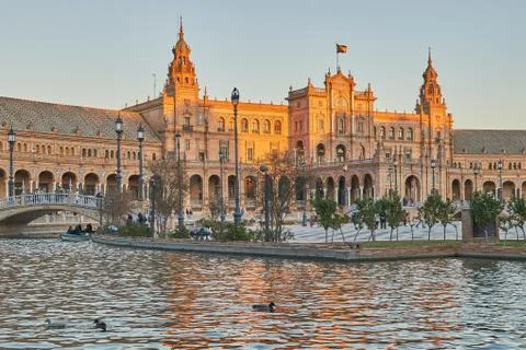 Sunset at the plaza de espana in Sevilla, Spain. Monumental building during s Stock Photos