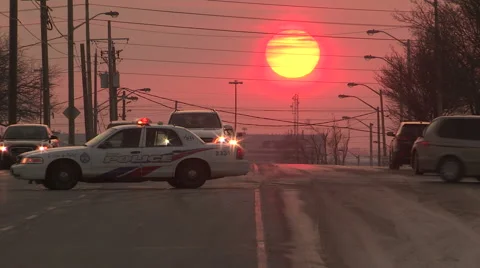 Sunset with police car cruiser blocking street at crime scene Stock Footage 47027291