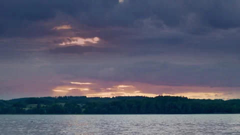 Sunset on a pond against the backdrop of an evening forest. Stock Footage 250806092