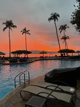 Sunset at the pool at the Hyatt Regency Maui Resort And Spa Stock Photos