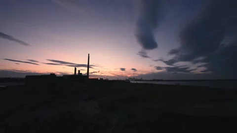 Sunset at poolbeg stacks in Dublin, Ireland Stock Footage 132299697