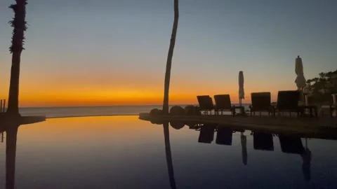 Sunset poolside view Stock Footage 236267092