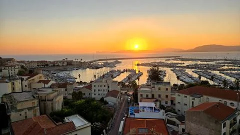 Sunset on the port of Alghero Stock Photos