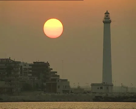 SUNSET at port with lighthouse close Video stock 11401859