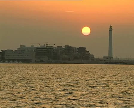 SUNSET at port with lighthouse Video stock 11401383
