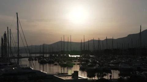 Sunset in the port with sailing yachts Stock Footage 183463560