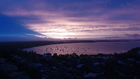 Sunset in Port Stephens Upward Pan Interesting Colours Stock Footage 77648909