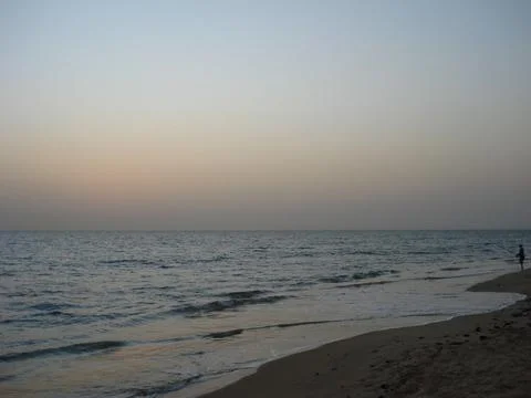 Sunset on a quiet beach Stock Photos