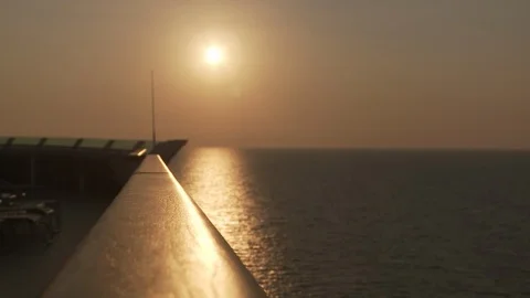 Sunset off the railing of cruise ship Stock Footage 87396272