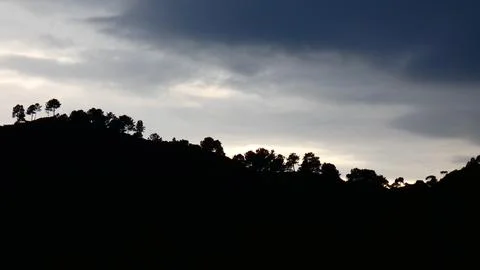 Sunset rain clouds on a winter afternoon in the mountains. 4k Stock Photos