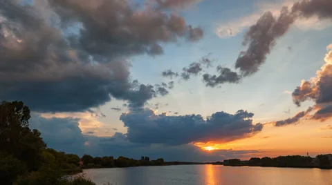 Sunset with rain over the lake. Time Lapse Stock Footage 63433119
