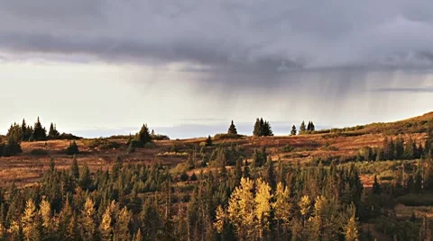 Sunset Rainfall on Distant Hill 2 - wide Stock Footage 8816530
