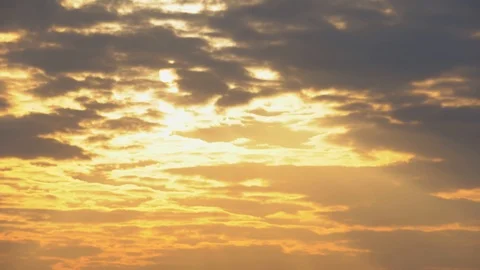 Sunset. Rays of the sun break through the orange, purple clouds. TimeLapse, 4K Stock Footage 120698734