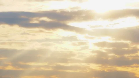 Sunset. Rays of the sun break through the orange, purple clouds. TimeLapse, 4K Stock Footage 120698785