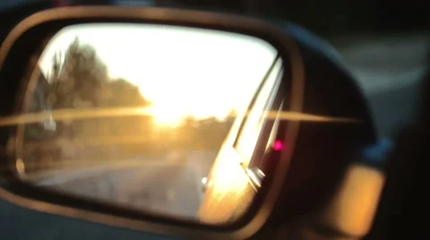 Sunset in rearview mirror Stock Footage 52598903