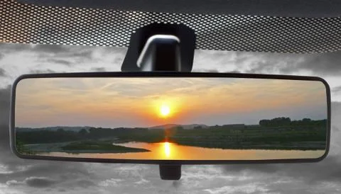 Sunset in the rearviewmirror Stock Photos