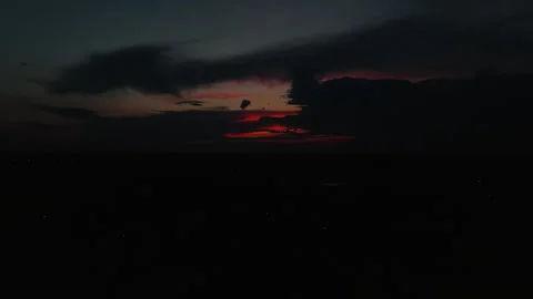 Sunset with red clouds in the dark sky Stock Footage 316289018